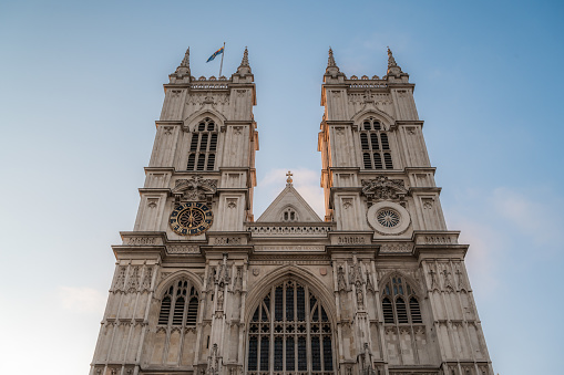 Main facade of Westminster Abbey against blue sky , Gothic style, in London, England, United Kingdom. High quality photo