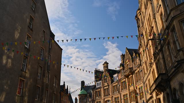 Victoria Street in downtown Edinburgh decorated with flags for the August party, Scotland.