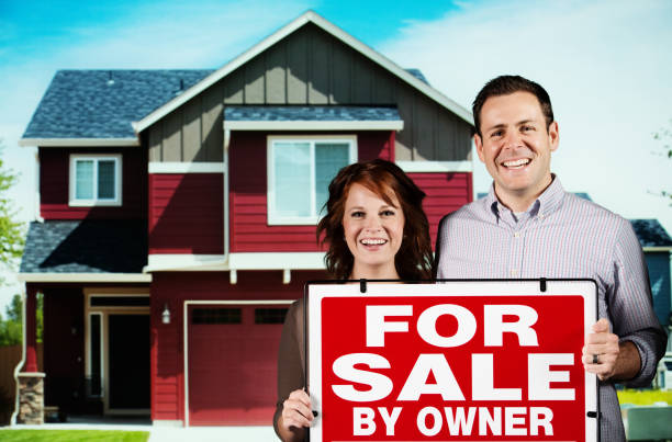 istock Couple with a For Sale signboard 171360147