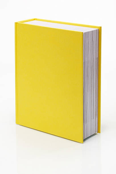 giallo vuoto libro - isolated on yellow foto e immagini stock