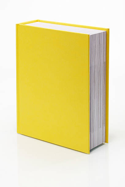 Blank Yellow Book Blank yellow book with real reflection. Clipping path included to place book on any background. Isolated On Yellow stock pictures, royalty-free photos & images