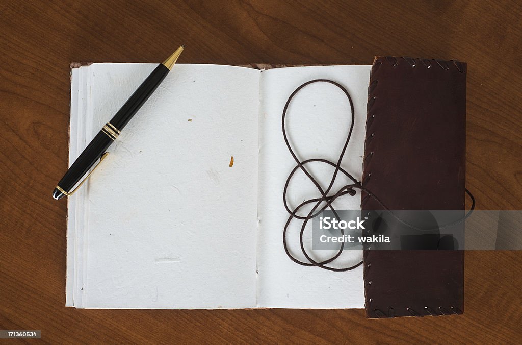 empty leather book diary or guestbook with Ballpoint pen empty leather book. Book is from the german brand Indiary Guest Book Stock Photo