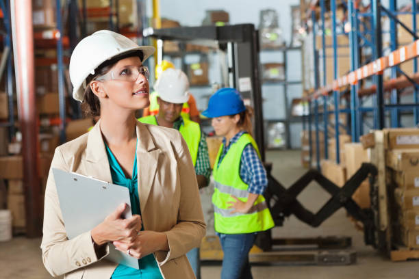 Company executive touring shipping distribution warehouse