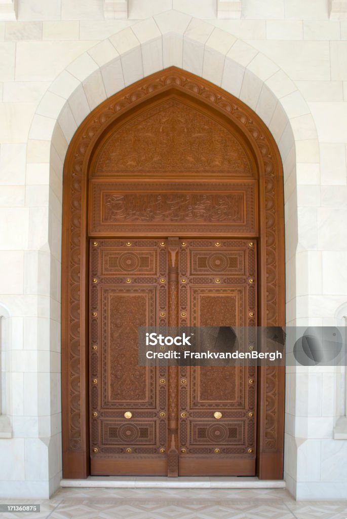 Carved Door Beautiful decorated door at the Sultan Qaboos Grand Mosque in Muscat. Arabia Stock Photo