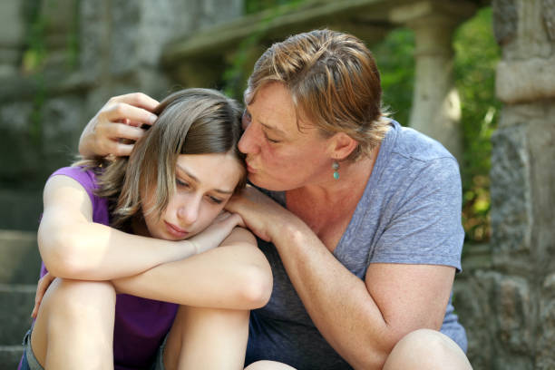 istock Mother consoles daughter with a kiss. 171361045