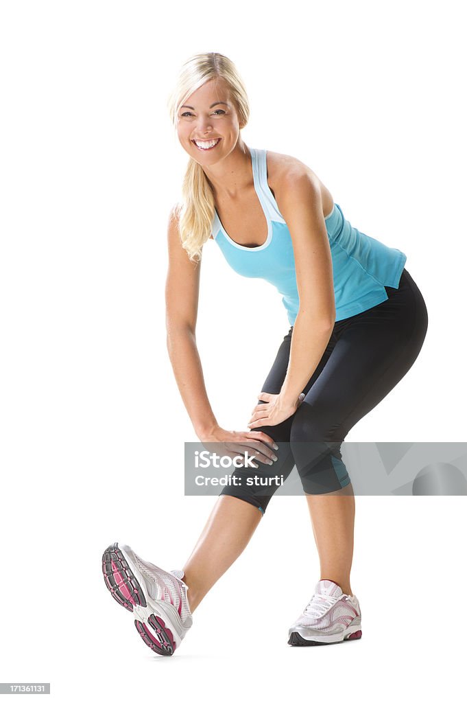 Fitness Woman Young Woman smiling while stretching Jogging Stock Photo