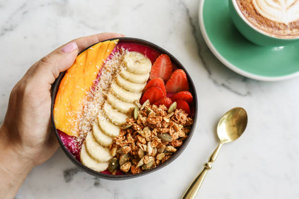 istock Smoothie bowl with strawberry, dragon fruit, mango and granola 1713611871
