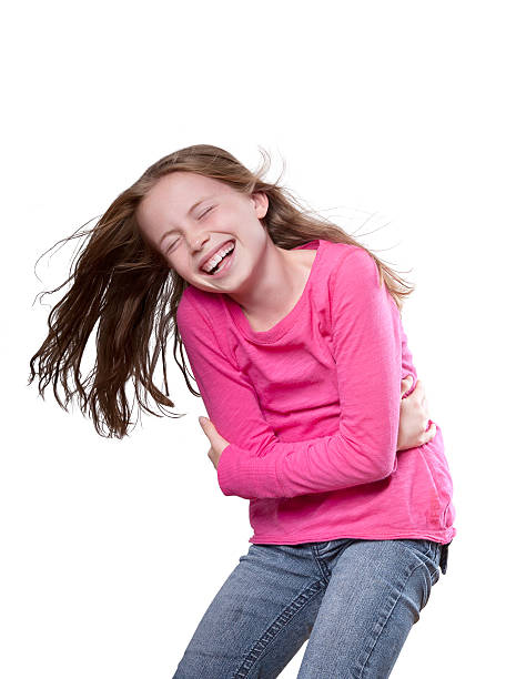 Beautiful young girl overjoyed with laughter Confident preteen model laughing hysterically child laughing hysterically stock pictures, royalty-free photos & images