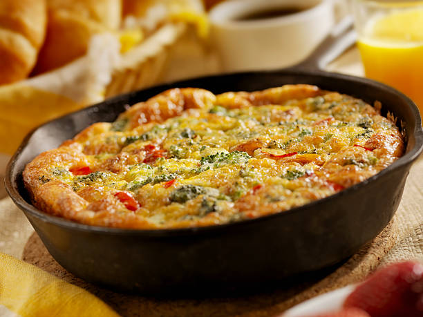 Cheese and Broccoli Frittata "Cheese and Broccoli Frittata with Roasted Red Peppers, Coffee, Orange Juice and Croissants - Photographed on Hasselblad H3D2-39mb Camera" frittata stock pictures, royalty-free photos & images