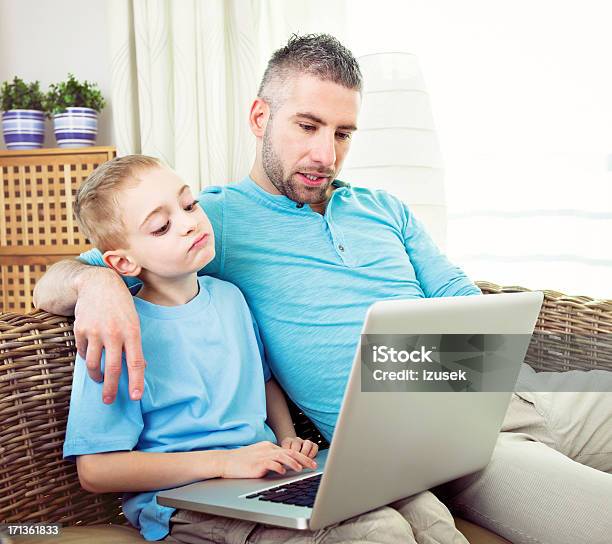 Happy Boy And Father With Laptop Computer Stock Photo - Download Image Now - Boys, Father, Internet