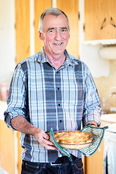 istock Senior man presents his pie 171361860