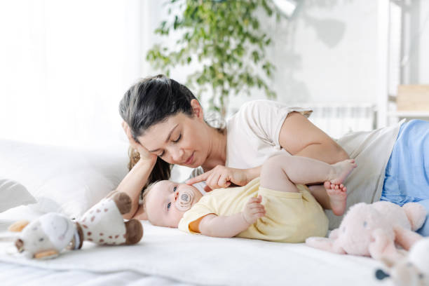 istock Mom cuddling with baby 1713620961