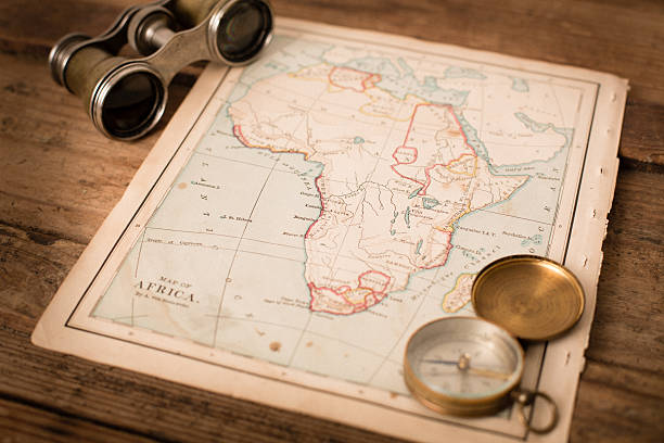 istock Antique 1870 Map of Africa, Binoculars, and Compass on Trunk 171362193