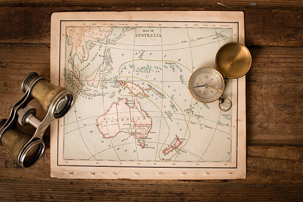 istock Antique 1870 Map of Australia, Binoculars, and Compass on Trunk 171362441