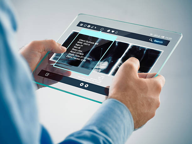 футуристический цифровой планшет в руках - doctor digital display digital tablet healthcare and medicine стоковые фото и изображения