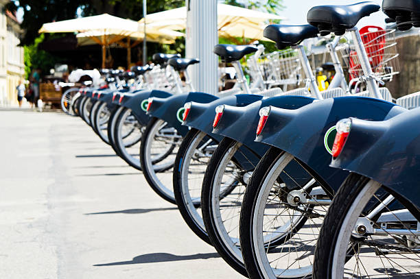 istock Group of city bikes ready for rent, arranged in raw 171363121
