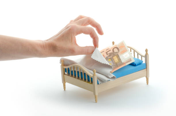 istock well sleeping money - Euro in bed 171363162