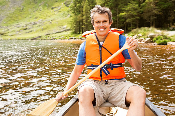 istock Man Canoeing In Lake 171363641