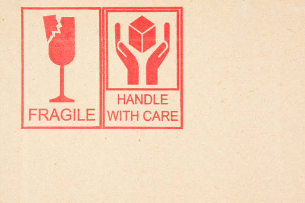 istock Fragile and Handle with Care Symbols on Cardboard 171363645