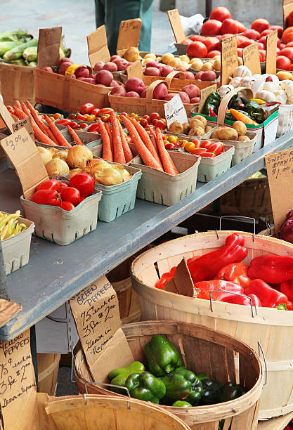 Market Stall Vegetables "Vegetables in a mid-summer Farmers Market in Kingston, Ontario, Canada." kingston ontario photos stock pictures, royalty-free photos & images