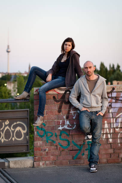 istock two young adults posing in front of TV tower 171364170