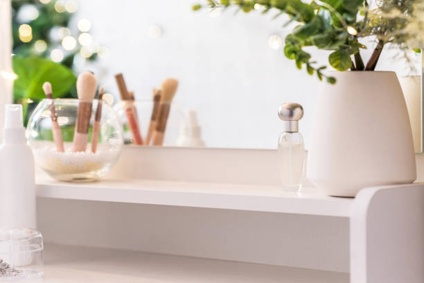 istock Reflection of christmas tree, light bulbs, in table mirror on woman dressing table with make up accessories 1713643487