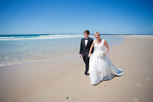 istock Laughing Newlyweds on the Beach 171364409