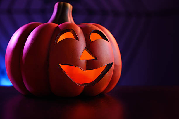 istock Halloween pumpkins in dark blue with spider web and smoke 171364648
