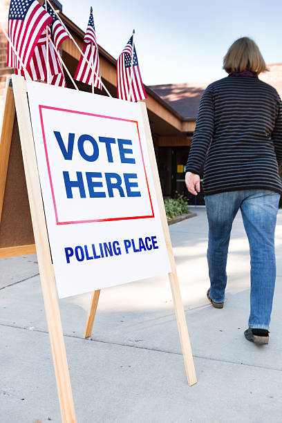 Voter Voting in Polling Place USA