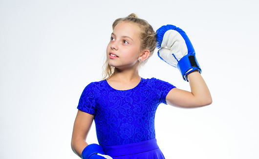Be strong. Upbringing for leadership and winner. Strong child boxing. Sport and health concept. Boxing sport for female. Girl child with blue gloves posing on white background. Sport upbringing.