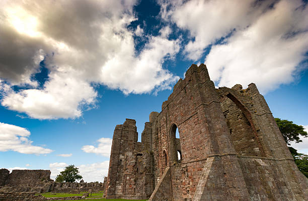 Lindisfarne Priory Lindisfarne Priory ruins. lindisfarne monastery stock pictures, royalty-free photos & images