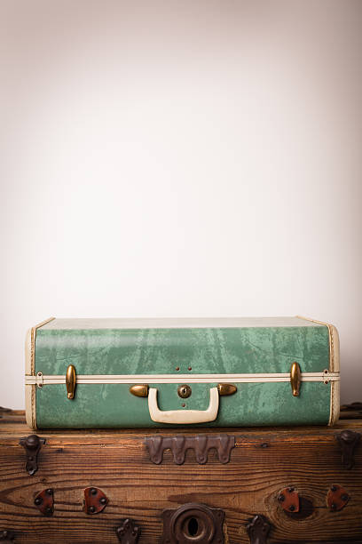 istock Retro Green Suitcase Sitting on Wood Trunk, With Copy Space 171365288