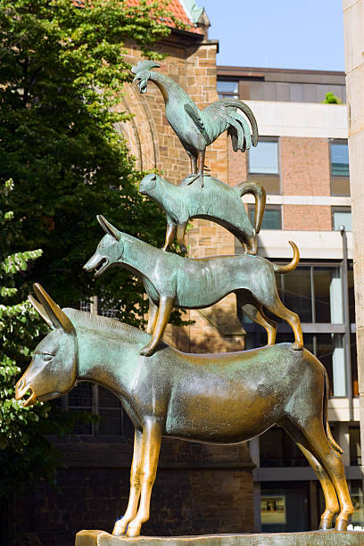 Town Musicians of Bremen: Die Bremer Stadtmusikanten. Statue based on folktale recorded by the Brothers Grimm. This bronze statue was built by Gerhard Marcks in 1953 and dedicated to town Bremen and folktale. It is loctaed at westside of city hall.