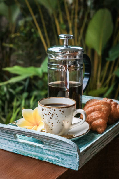 istock Cup of coffee with croissant 1713653270