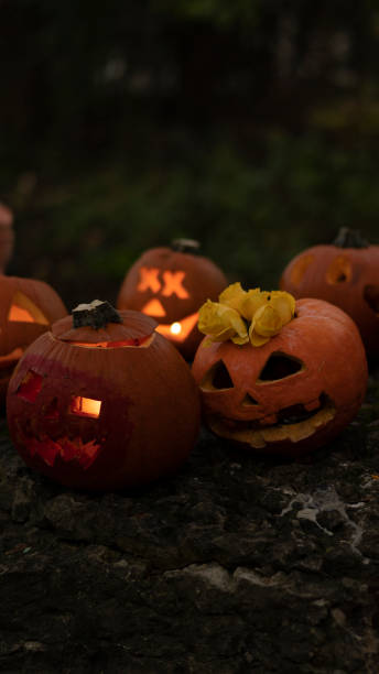 istock Autumn orange pumpkins with spooky faces 1713653941