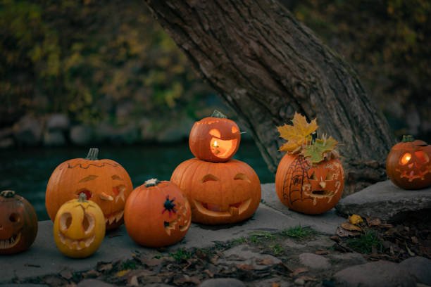 istock Spooky orange pumpkins with fun faces 1713653957