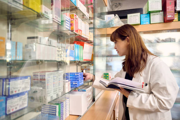 istock Female middle-aged pharmacist working in her pharmacy. 1713654013