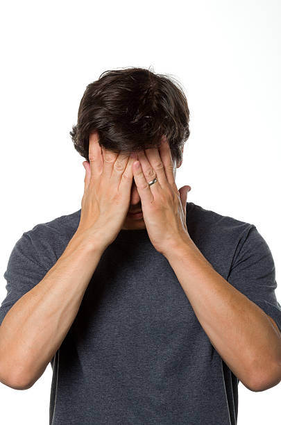 Holding Head in Shame stock photo