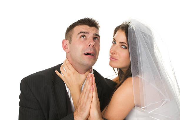 angry married couple "close up of fighting married couple as a unhappy wedding concept, isolated on white background" woman strangles man stock pictures, royalty-free photos & images