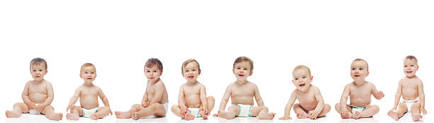 Group of babies Group of eight smiling cheerful babies on white background, isolated, studio shoot group of babies stock pictures, royalty-free photos & images