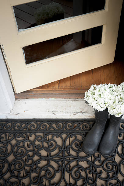 istock Rubber boots in front of old opened door 171365797