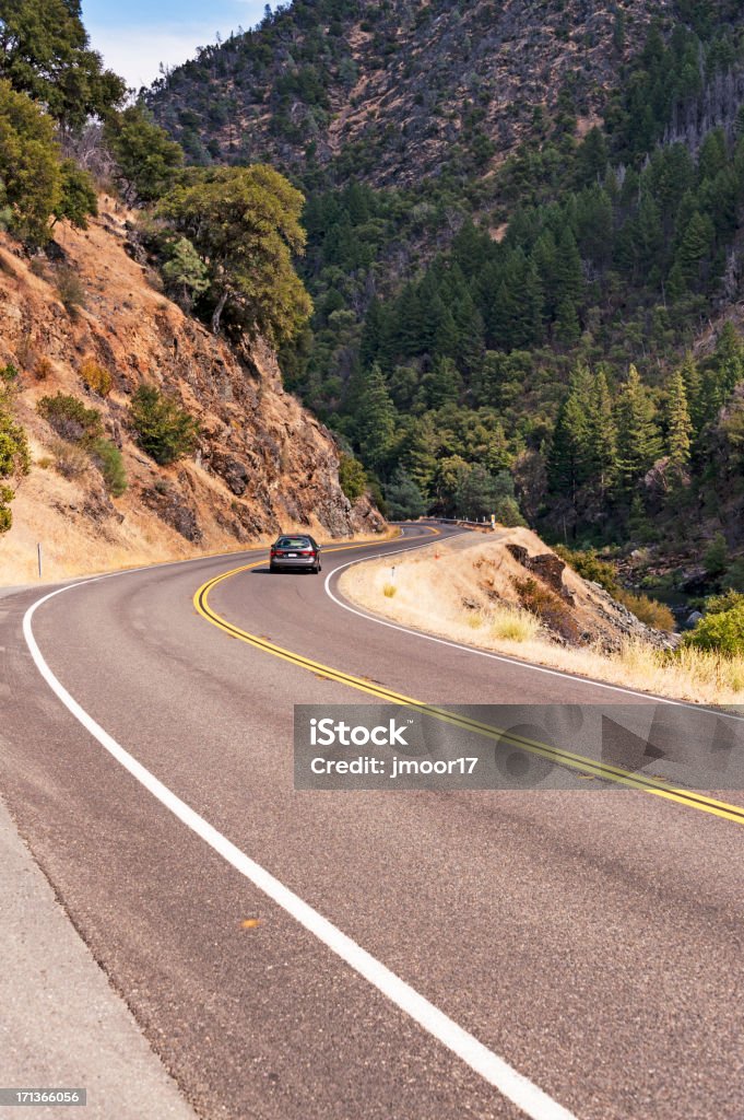 Canyon Road "This autombile is driving along the curved canyon road near Burnt Ranch, California in Northern California." Backgrounds Stock Photo