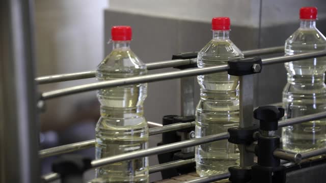 Automated Vinegar Production Line in an Industrial Factory of Bottling Process in Close-Up