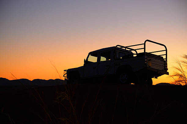 istock Car after sunset on a red dune 171366187
