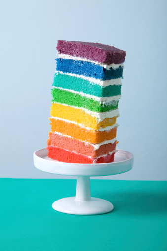 a slice of rainbow cake