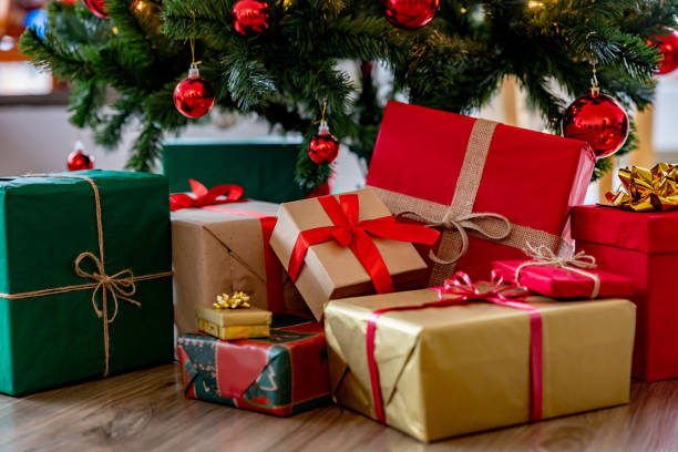 istock Beautiful wrapped gifts under the Christmas Tree 1713668604