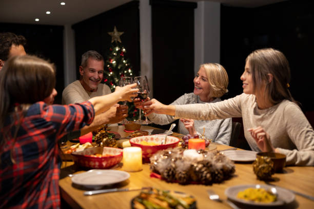 istock Happy family making a toast while celebrating Christmas together 1713668670