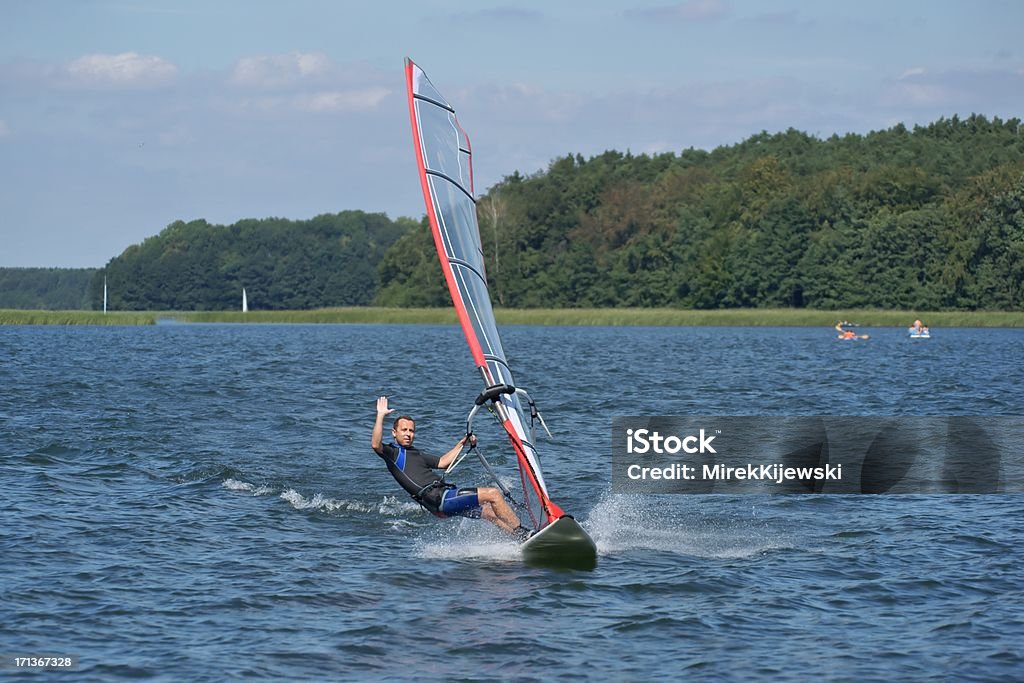 Windsurfing Windsurfing on the lake Niesłysz, Poland Adult Stock Photo