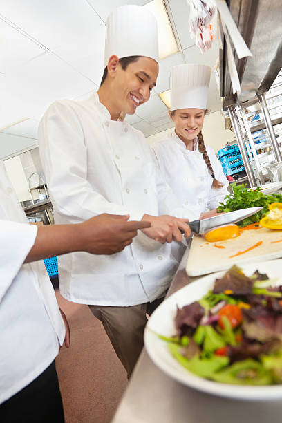 istock Happy chefs preparing salads in a commercial restaurant kitchen 171367379