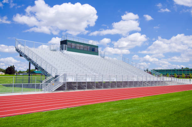 Bleachers at a high school football field with track Bleachers at a high school football field with track. school bleachers stock pictures, royalty-free photos & images
